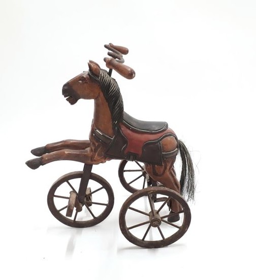 Petit tricycle en forme de cheval en métal…
