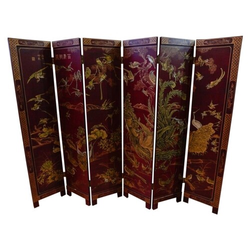 RED LACQUER SIX-FOLD SCREEN EARLY 20TH CENTURY with gilt chi...