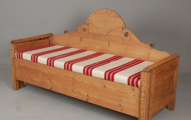 SOFA/PULL-OUT BED, with a late Empire sun canopy, mid 19th century.