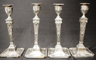 Set of 4 sterling silver Adams style candlesticks decorated...