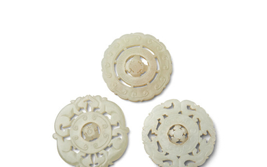 Three circular jade pendants