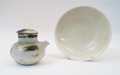 Two Chinese Song-style vessels, 20th century, comprising a carved plate in Qingbai-style glaze, 17.2cm; and a small celadon-glazed jarlet and cover with spotted decoration, 9cm high (2)