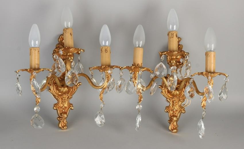 Two plated brass wall sconces with crystal icicles.
