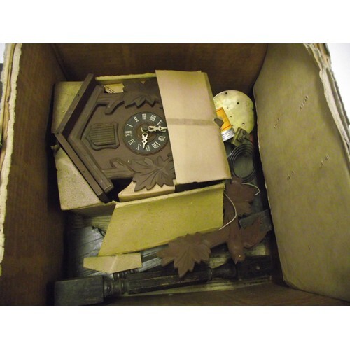 Vintage cuckoo clock and other clock parts.