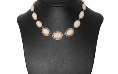 White gold necklace with 13 pink coral ovals