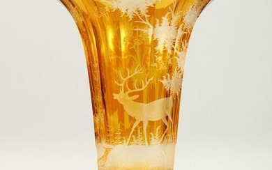 A LARGE BOHEMIAN AMBER VASE, etched with deer in a
