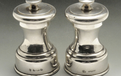 A small pair of early twentieth century silver mounted pepper mills.