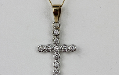 9CT GOLD AND DIAMOND CROSS PENDANT WITH 9CT CHAIN.