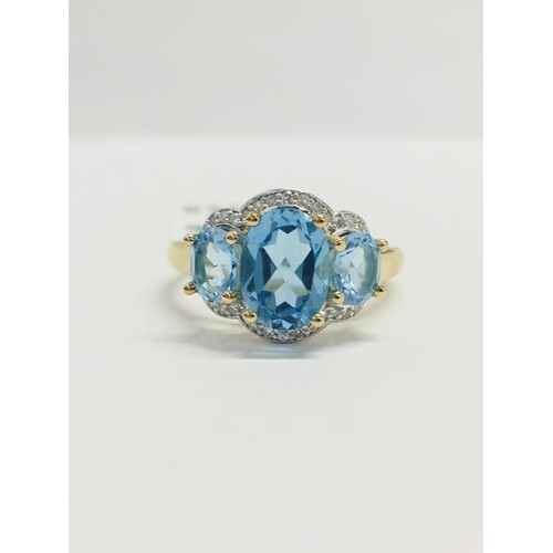 9CT Yellow gold Blue topaz and diamond ring, 30 single cut n...