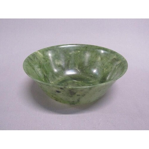 A 19c Oriental green stone bowl (possibly jade), 18cm diam.