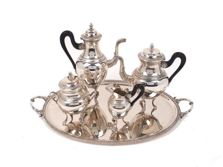 A 19th century French silver plated coffee service comprising coffee pot, tea pot, sugar, milk jug and oval twin-handled tray, the pots of empire style design with zoomorphic spouts and acanthus bud finials to hinged lids, each piece raised on...