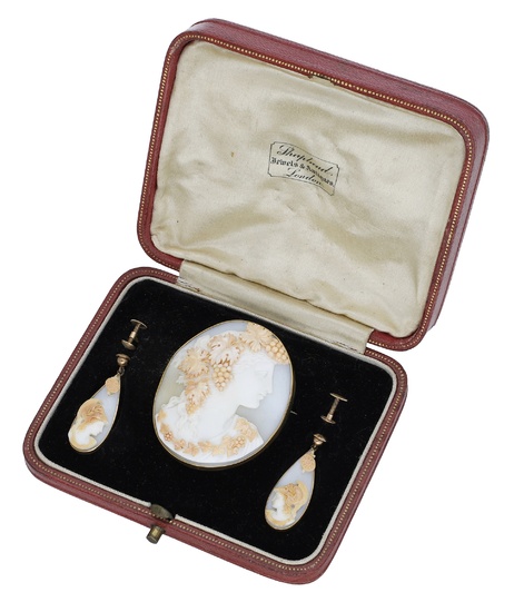 A 19th century shell cameo brooch and pair of earrings, the oval...