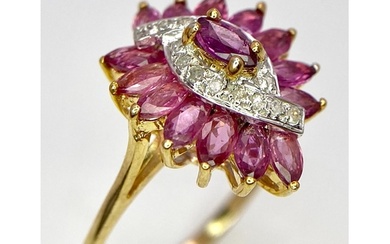 A 9K YELLOW GOLD DIAMOND AND RUBY FANCY SPIRAL CLUSTER RING....