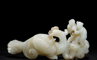 A CARVED JADE BIRD AND BOY ORNAMENTS