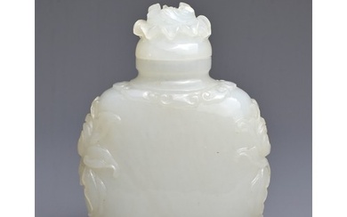 A CHINESE MUGHAL STYLE WHITE JADE SNUFF BOTTLE WITH COVER. V...