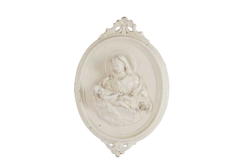 A CONTINENTAL WHITE GLAZED POTTERY WALL PLAQUE, 19TH CENTURY