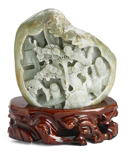 A Chinese ''boulder'' of green jade. Weight 1619 g. H. 14 cm. On wooden base.
