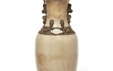 A Chinese creamy crackle glaze and faux-bronze-mount baluster vase, late Qing dynasty,...