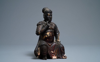 A Chinese gilt lacquered wood figure of Guan...