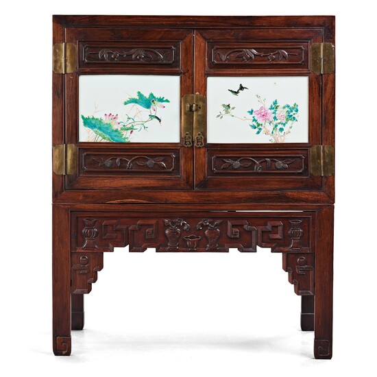 A Chinese wooden cabinet with two porcelain placques, early 20th Century.
