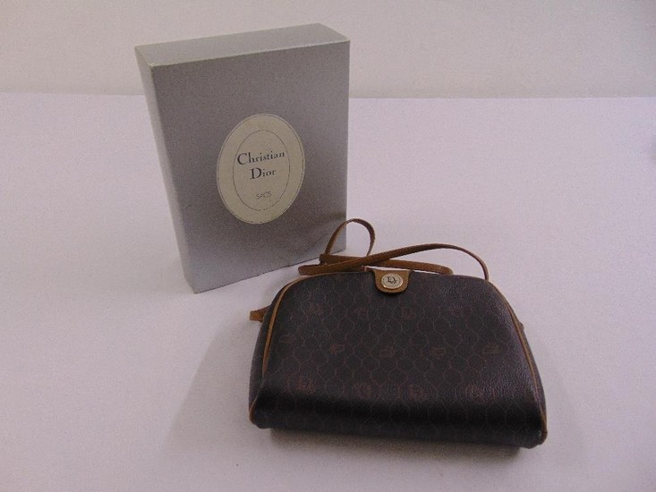 A Christian Dior leather bag with strap handle in original p...