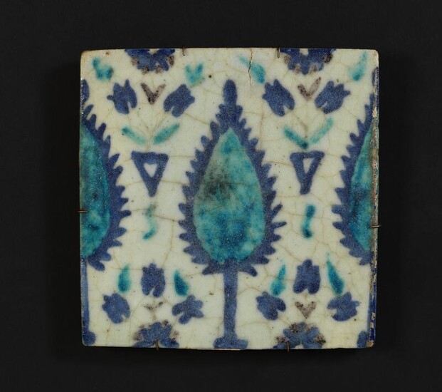 NOT SOLD. A Damascus pottery tile decorated in blue, turquoise and manganese with flowers and design. Syria, 18th century. 23 × 23 cm. – Bruun Rasmussen Auctioneers of Fine Art
