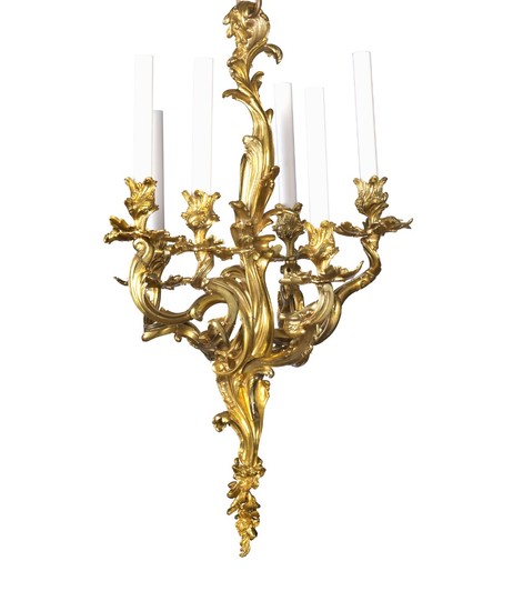 A French Rococo style gilt bronze chandelier adorned with five foliage candle arms mounted for electricity. Mid-19th century. H. 68 cm. Diam. 43 cm.