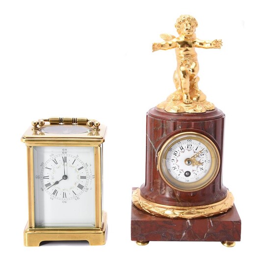 A French gilt metal and veined red marble mantel clock case in late 19th century taste