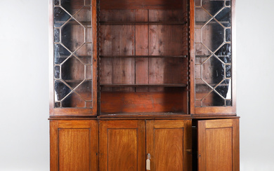 A GEORGE III AND LATER MAHOGANY BREAKFRONT BOOKCASE, RETAILED BY S & H JEWELL, HIGH HOLBORN, LONDON.