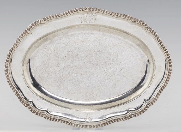 A GEORGE III GADROONED SILVER SECOND COURSE DISH FROM A DINN...