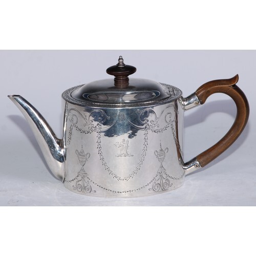 A George III Provincial oval drum teapot, bright-cut engrave...