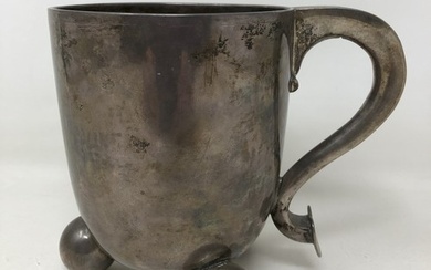 A George III silver mug, raised on three ball feet, by John ...