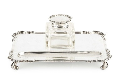 A George V silver inkstand, of shaped rectangular form, fitted...