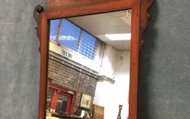 A Georgian style mahogany wall mirror, the fretwork scrolled crest...