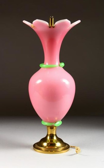 A LARGE PINK GLASS LAMP on a circular brass base.
