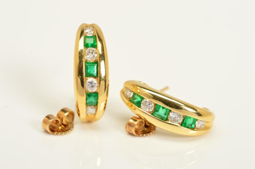 A PAIR OF 18CT GOLD, DIAMOND AND EMERALD EARRINGS, each desi...
