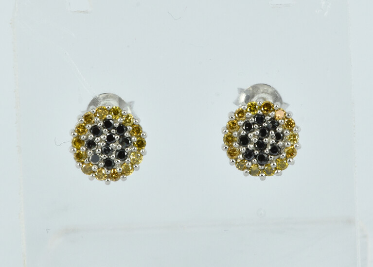 A PAIR OF DIAMOND AND SILVER STUD EARRINGS