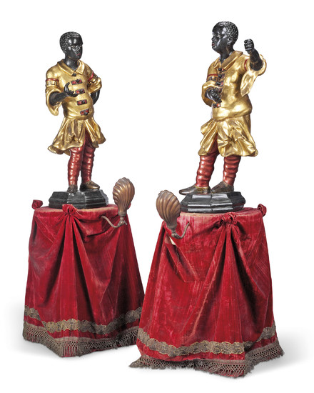 A PAIR OF ITALIAN CARVED GILT AND PAINTED BLACKAMOOR FIGURES, PROBABLY LATE 17TH/EARLY 18TH CENTURY