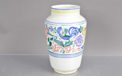 A Poole Pottery vase hand-painted with flowers and birds