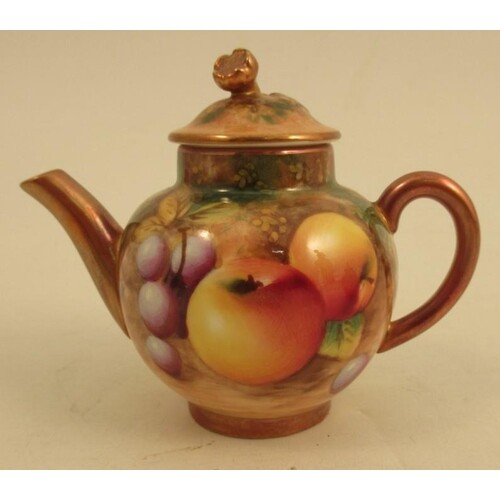 A Royal Worcester miniature tea pot, decorated with fruit by...
