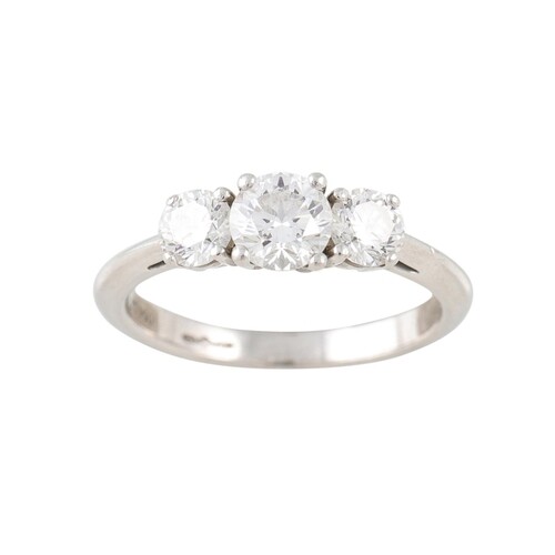 A THREE STONE DIAMOND RING, By Tiffany & Co., the brilliant ...