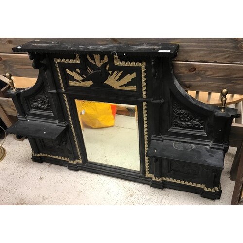 A Victorian cast iron overmantel mirror with central eagle a...