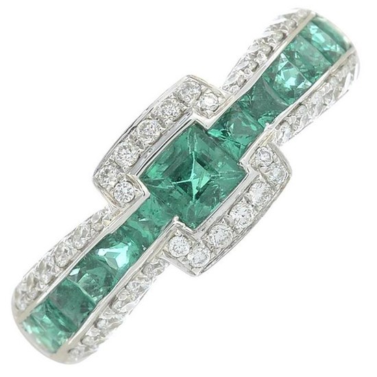 A brilliant-cut diamond and emerald dress ring.Total