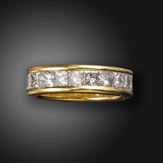 A diamond full-circle eternity ring, the princess-cut diamonds channel-set in...