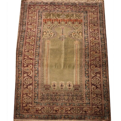A fine knotted Ottoman empire Turkish prayer rug, woven with...