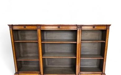 A large Victorian style satinwood dwarf open bookcase The...