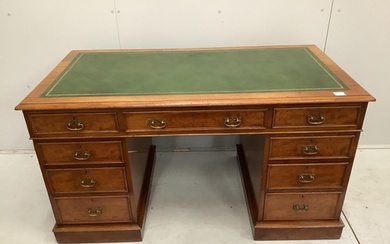 A late Victorian mahogany pedestal desk by Maple and Co., wi...