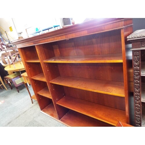 A mahogany bookcase with six adjustable shelves