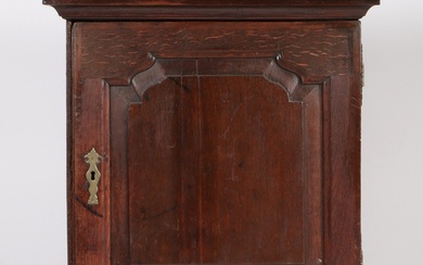 A mid-18th century oak mural spice cabinet The stepped ped...