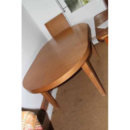 A modern cherrywood oval extending dining table with extra l...